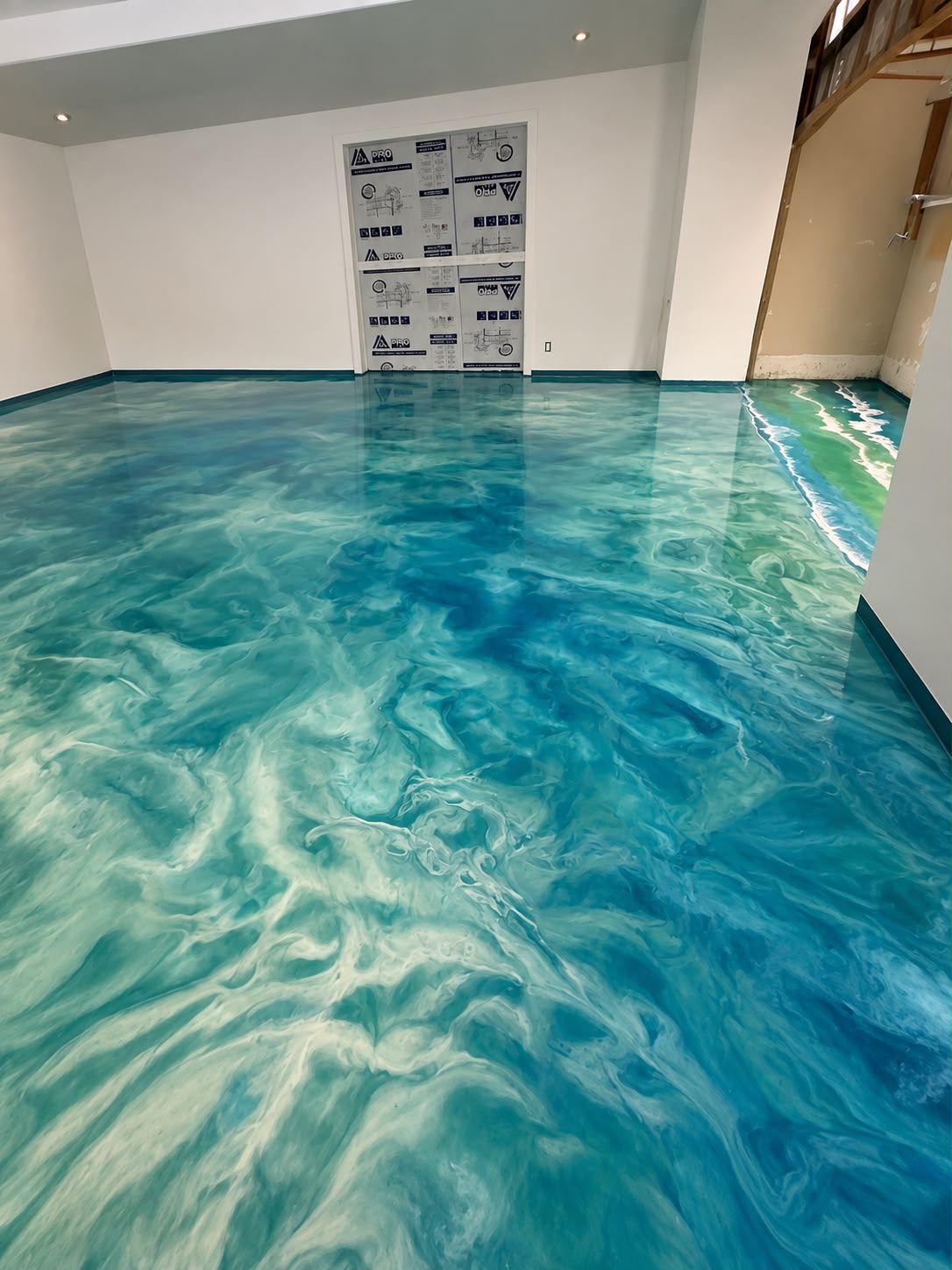 Turquoise ocean epoxy floor with breaking wave edge