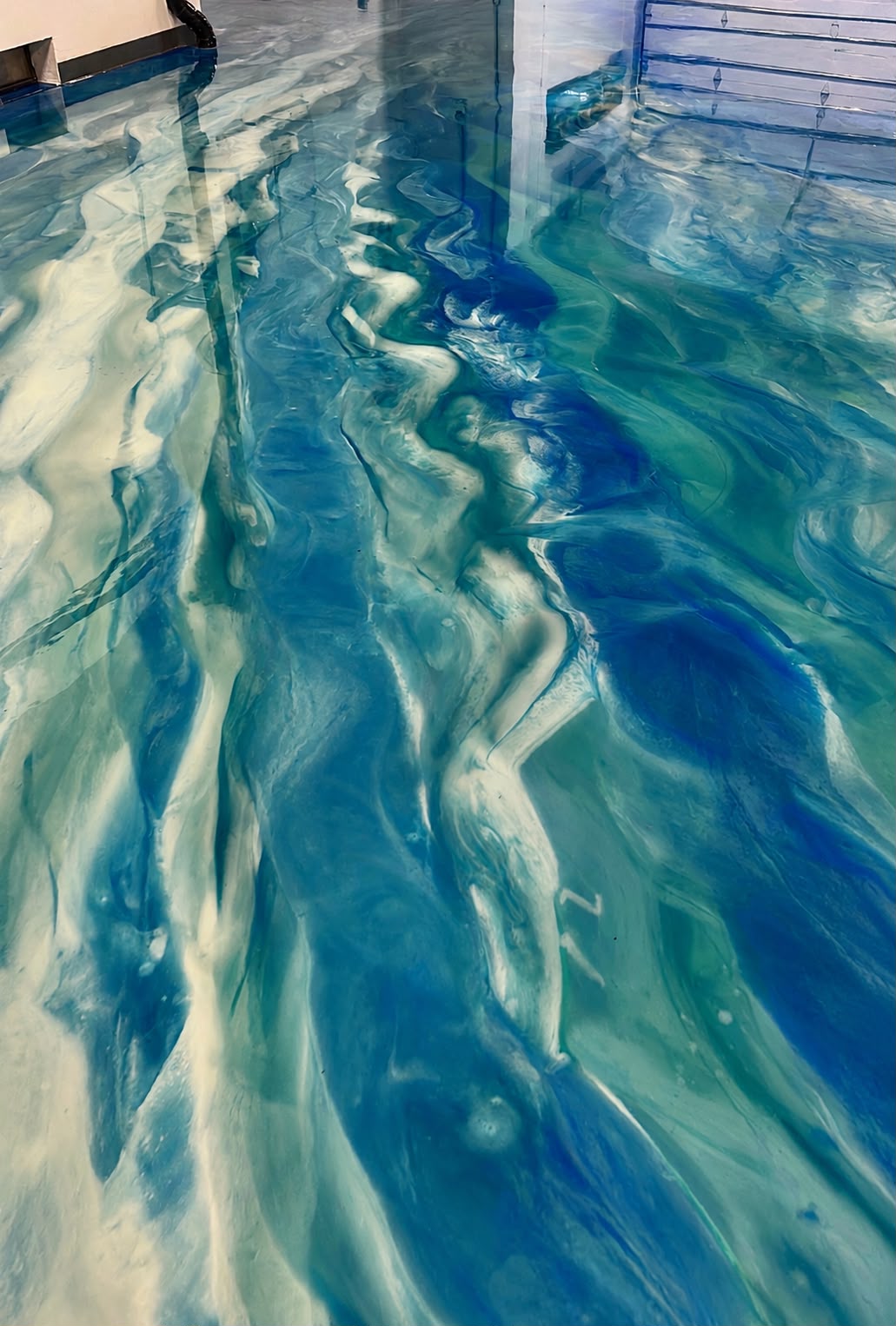 Deep blue and ivory metallic epoxy floor detail